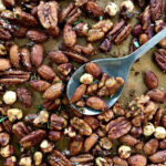 mixed roasted nuts on baking sheet