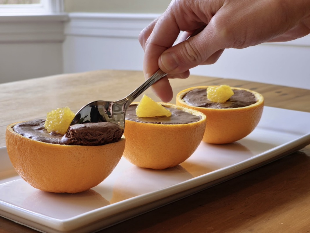 Three Chocolate-Orange Aquafaba Mousse served in a cup.